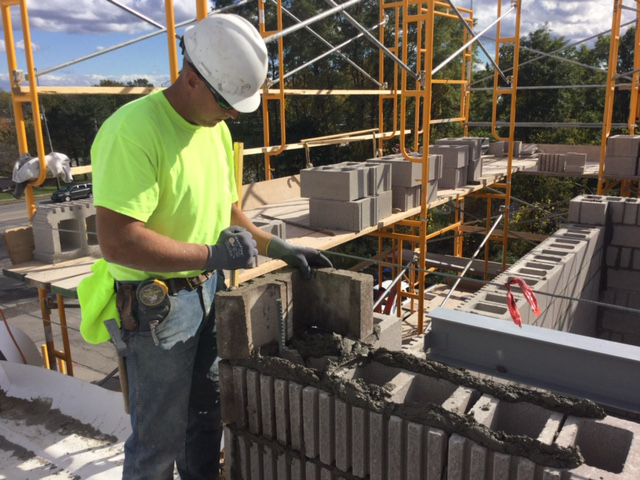 Construction worker working on masonry.
