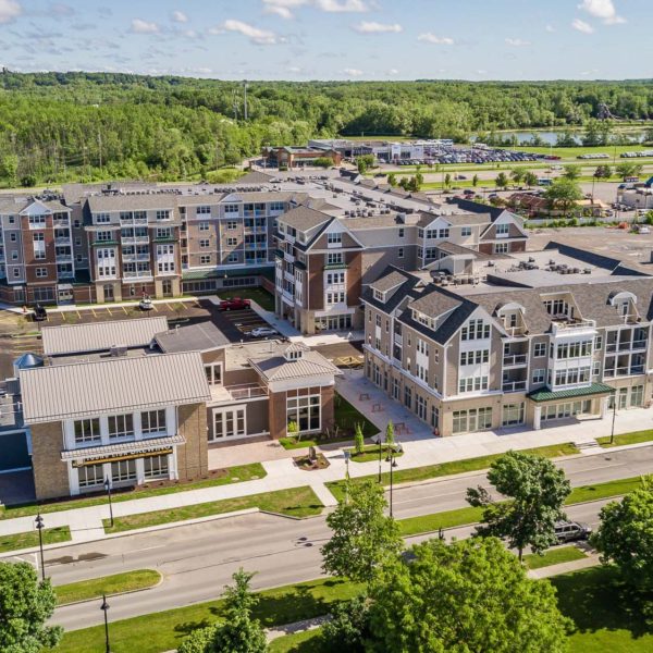 Close-up aerial of the mutli-unit buildings and retail space