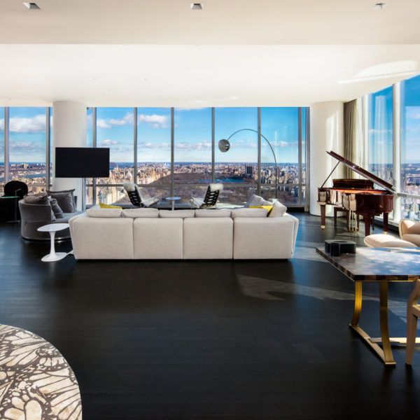 Penthouse with furnishings overlooking city skyline.