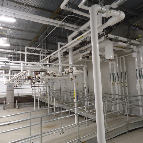 Interior of white piping and clean space for manufacturing facility.