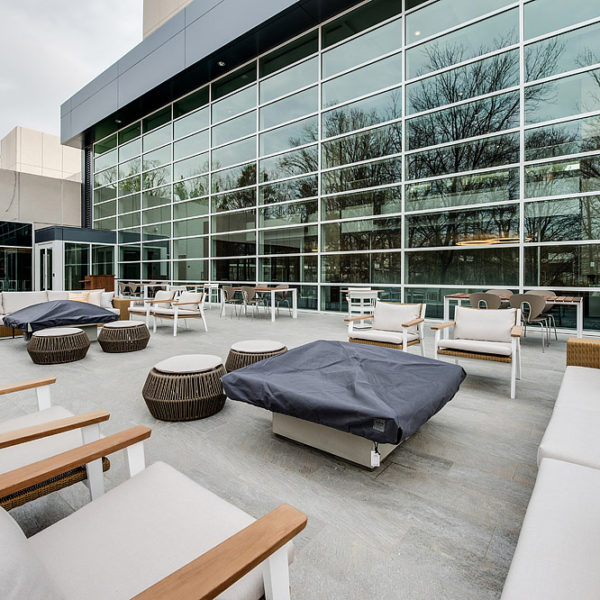 Patio with chairs, couches and fire pits