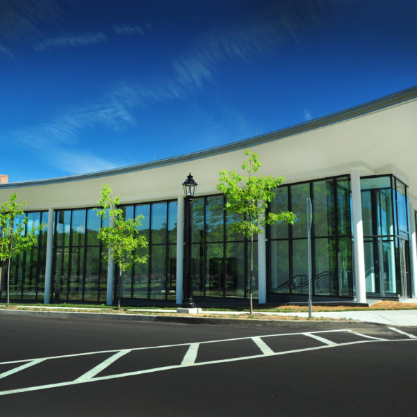 Exterior of the building showing the glass windows and curved roof