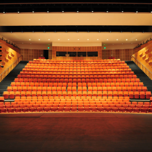 View from standing on stage facing the seats in the large auditorium.