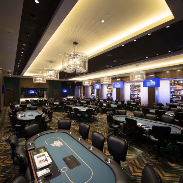 Large room with multiple poker tables