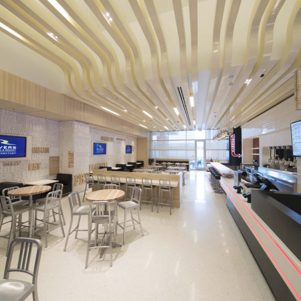 Food court area with high top tables and chairs.