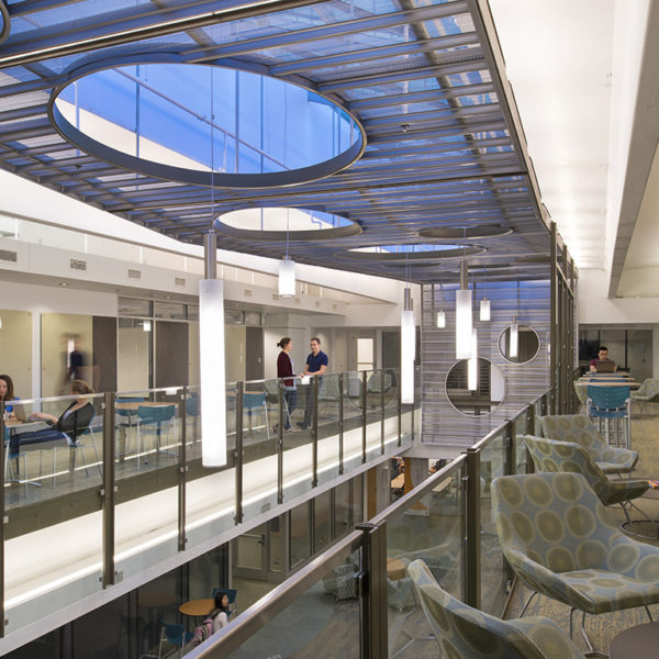 Second floor of building with chairs and students.