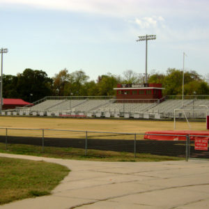 Stadium with grass field and grand stand