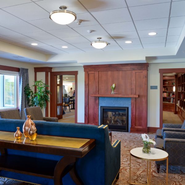 Sitting area with couch, chairs and fireplace