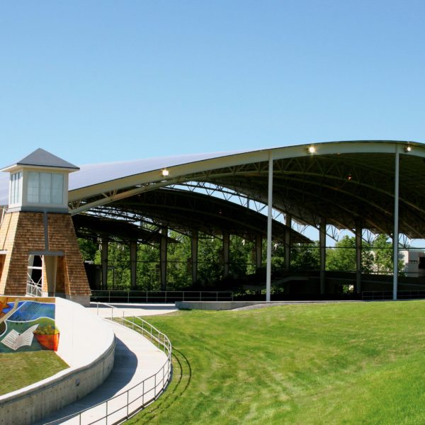 View from standing in the lawn looking at the shell covering the seats.