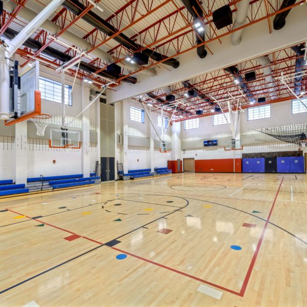 Elementary school gym with basketball hoops