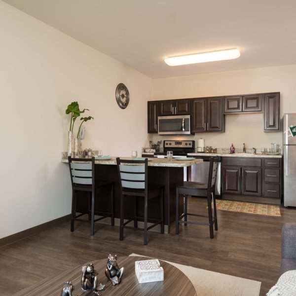 Kitchen with counter and stools