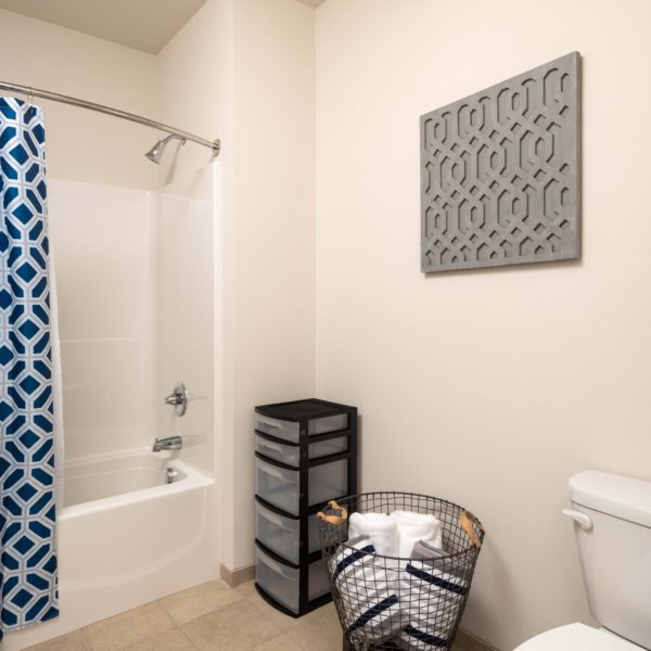 Bathroom with blue shower curtain