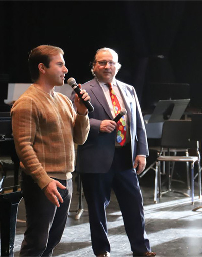 Raymond W. LeChase II and Ray LeChase Jr speak at the HS career day at McQuaid