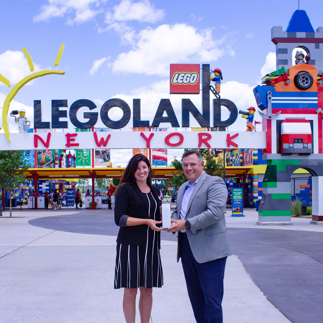 Stephanie Johnson and David Campbell with the award for Legoland® New York Resort 