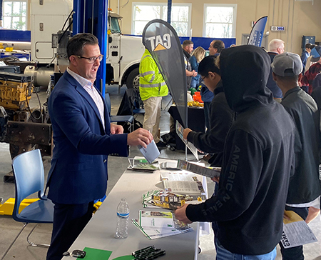 Mike Corey talking with students at the BOCES event in Albany.