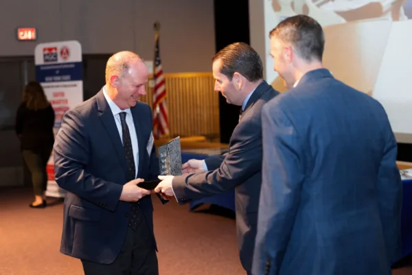 Jim accepts the award