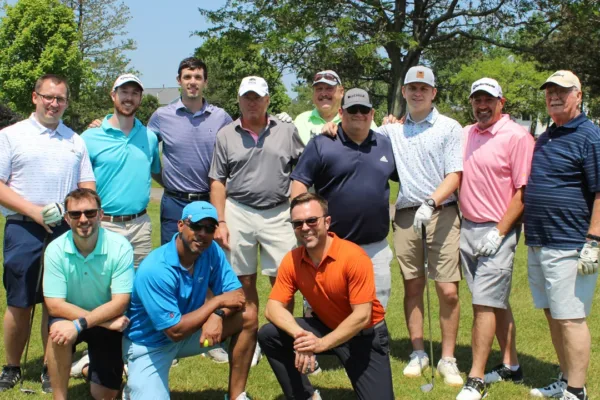 Big group of golfers on the course