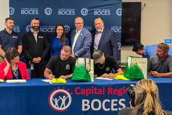 Two new employees signing with LeChase at BOCES Signing Day
