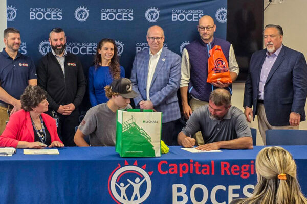 New employee signing with LeChase at BOCES Signing Day