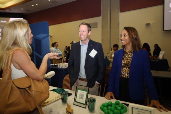 Seth and Denise at the LeChase table at the NC State Construction Conference expo