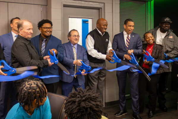 Team cutting the ribbon at the new Boys and Girls Clubs teen center