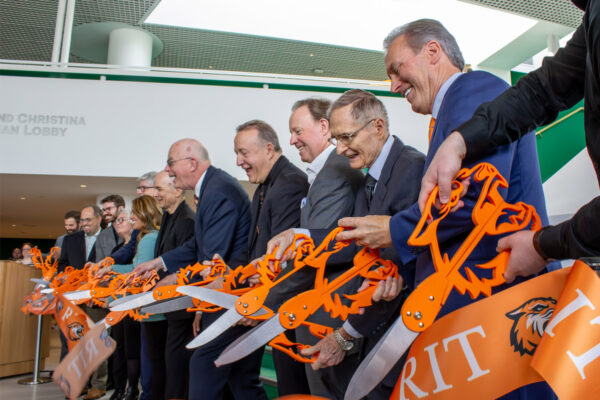 Team cutting the ribbon at the new RIT Performing Arts Center