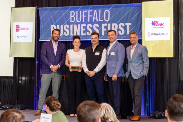 LeChase team accepting the Brick by Brick Award for the John kam Building